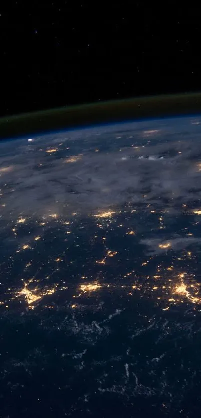 Stunning view of Earth from space at night with glowing city lights.