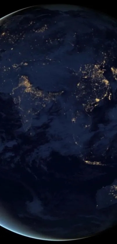 Nighttime Earth from space with illuminated city lights and dark oceans.