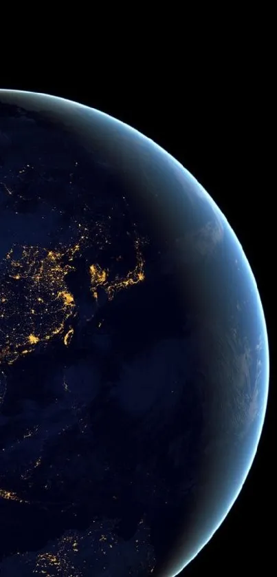 Earth at night with city lights visible from space in a dark setting.