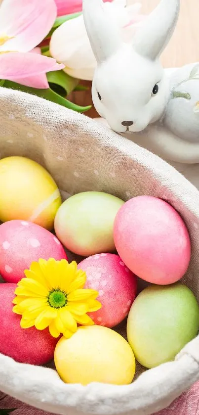 Colorful Easter eggs in a basket with a bunny figurine and flowers.