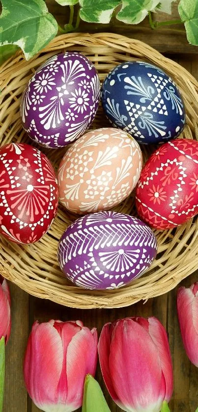 Colorful Easter eggs in basket with tulips and greenery.