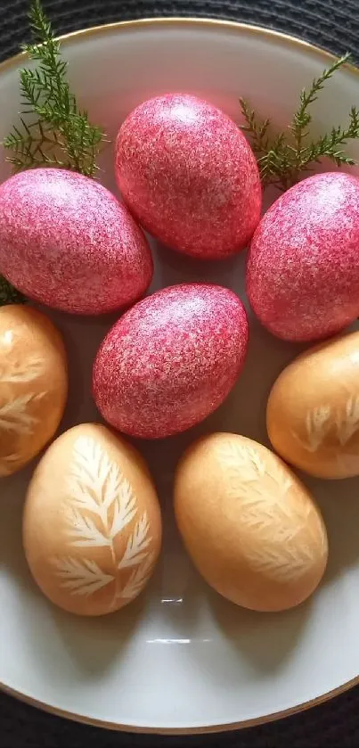 Decorative Easter eggs on a plate with greenery, in pink and brown hues.