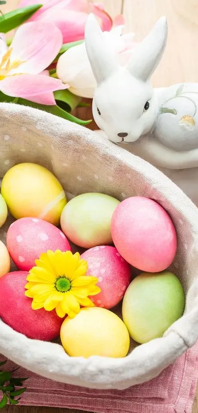 Colorful Easter eggs in a basket with flowers and a white rabbit figurine.