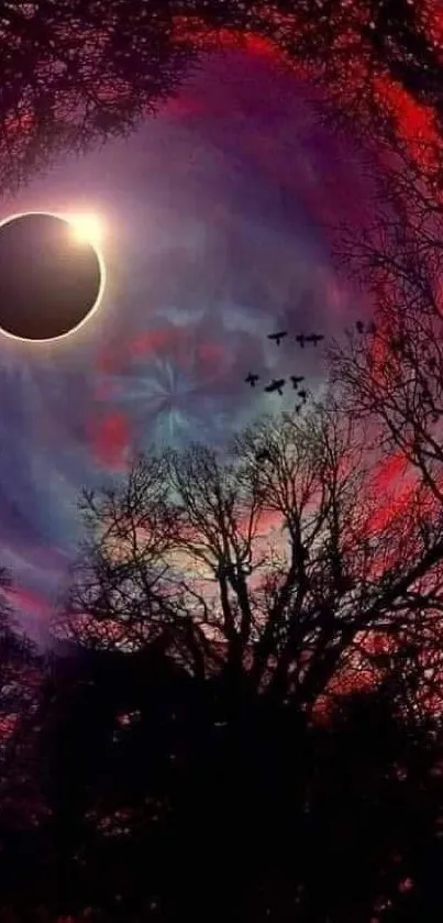 Solar eclipse with vibrant red sky and silhouetted trees.