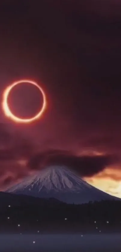 Solar eclipse over mountain against dramatic twilight sky.