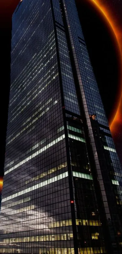 Tall skyscraper with an eclipse backdrop at night.