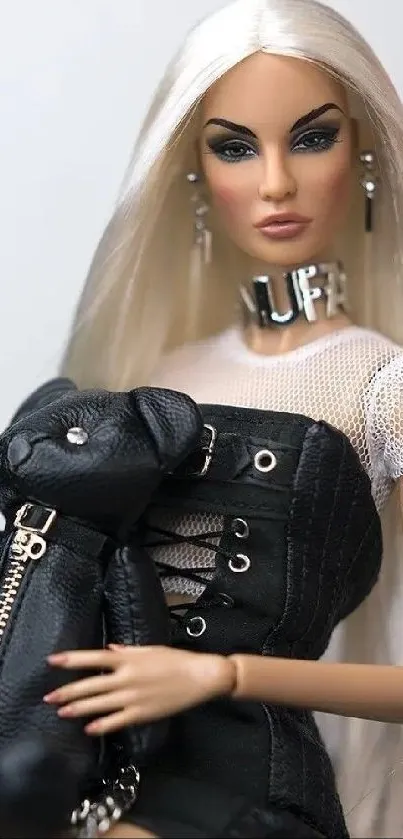 Fashionable doll with blonde hair and leather teddy bear in edgy style.