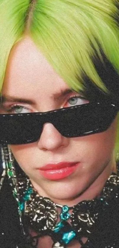 Stylish person with vibrant green hair and sunglasses.