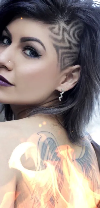 Woman with edgy hairstyle and wing tattoo on shoulder.