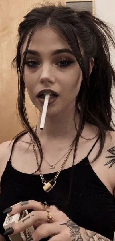 Tattooed girl with edgy style holding cigarette, set as phone wallpaper.