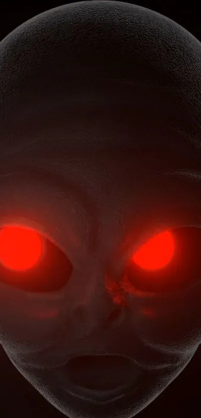 Close-up of alien face with glowing red eyes on a dark background.