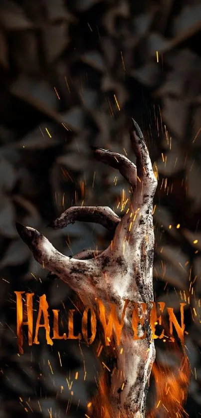 Spooky Halloween hand with fiery effect and dark background.