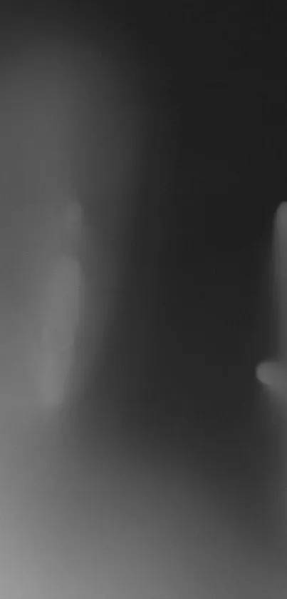 Eerie silhouette with haunting shadows on a monochromatic mobile wallpaper.