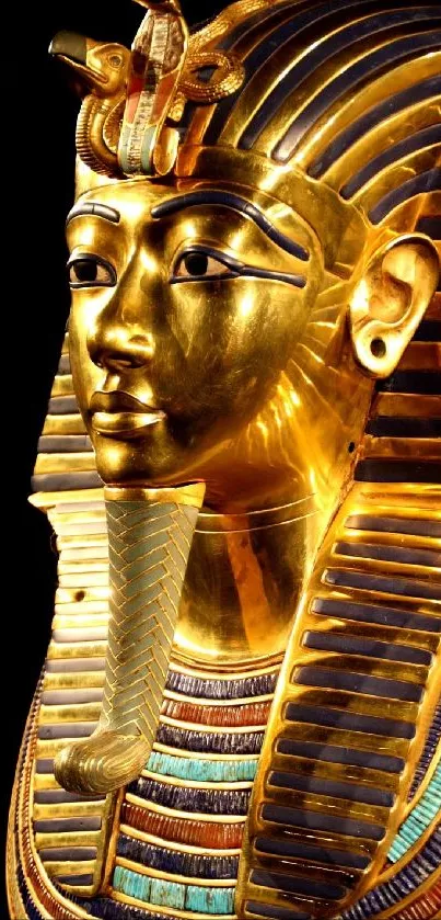 Golden Egyptian pharaoh mask with intricate details.