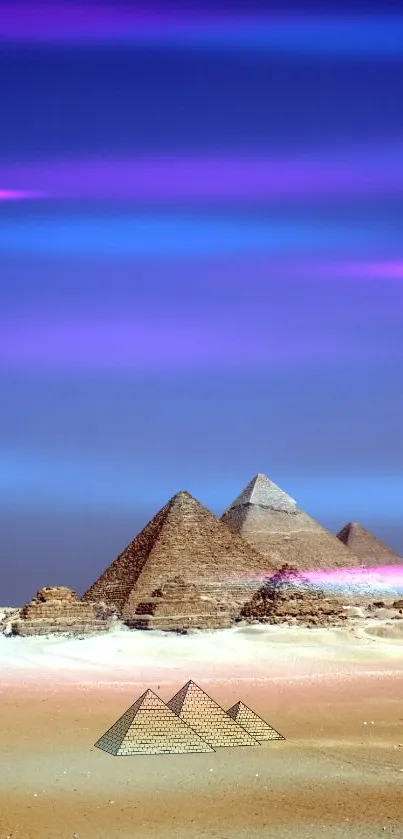 Egyptian pyramids at sunset with vibrant blue sky and golden sand.