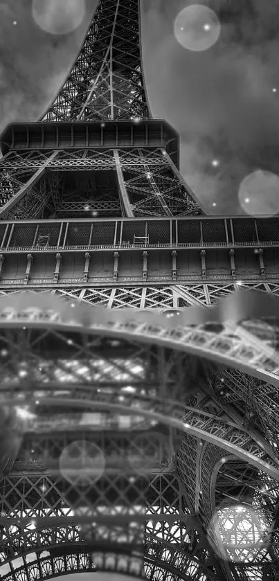 Monochrome Eiffel Tower view with bokeh in the sky.