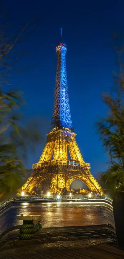 Eiffel Tower beautifully lit against a dark blue night sky in Paris.