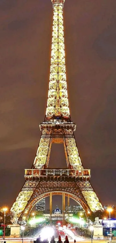 Illuminated Eiffel Tower at night in Paris wallpaper.