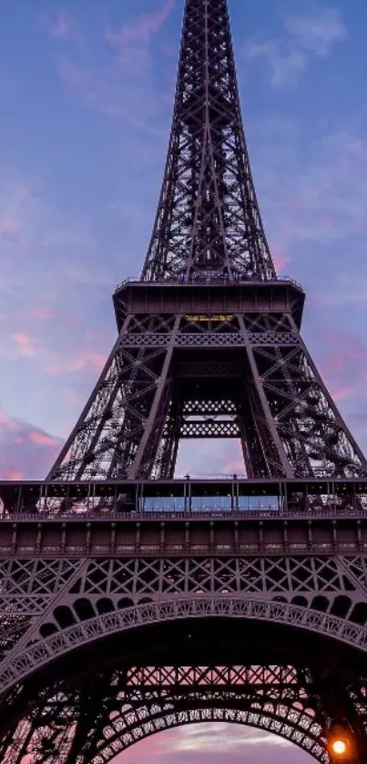 Eiffel Tower at sunset with vibrant sky colors.