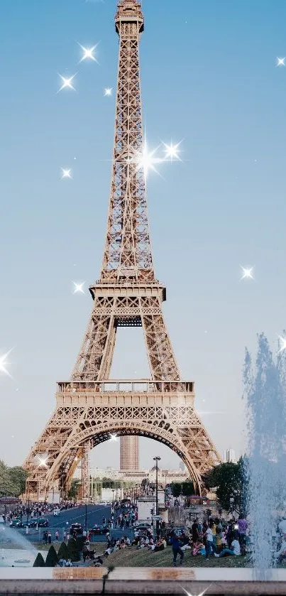 Eiffel Tower sparkling under a bright blue sky.