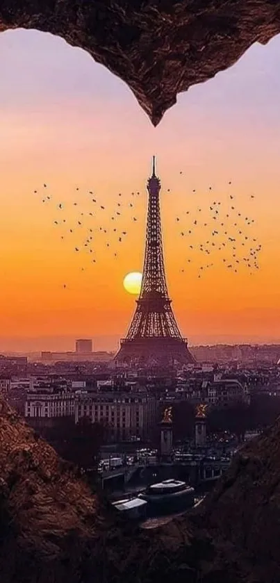 Eiffel Tower framed by heart-shaped cliff at sunset in Paris.