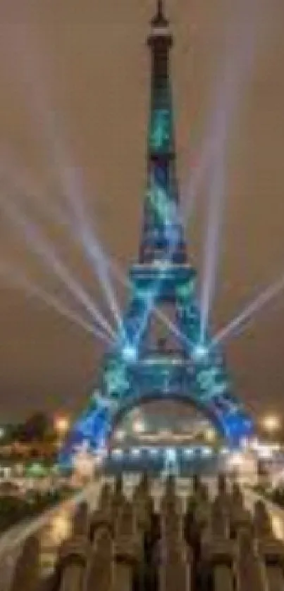 Illuminated Eiffel Tower against night sky in Paris, reflecting in nearby fountain.