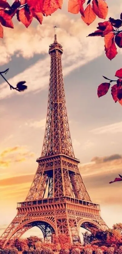 Eiffel Tower with autumn leaves and a golden sky background.