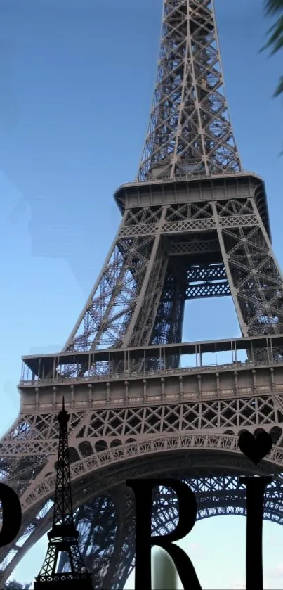 Mobile wallpaper of the Eiffel Tower with a clear blue sky in Paris.