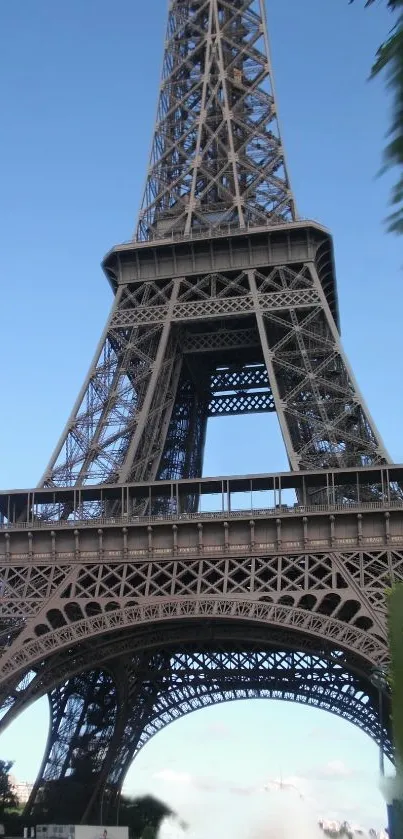 Eiffel Tower with clear blue sky background in mobile wallpaper.