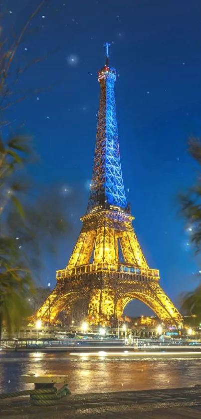 Eiffel Tower illuminated against a midnight blue sky at night.