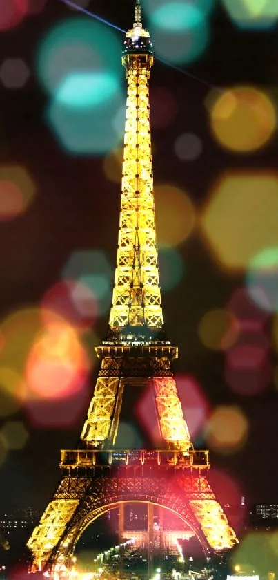 Eiffel Tower illuminated at night with a dazzling golden glow.