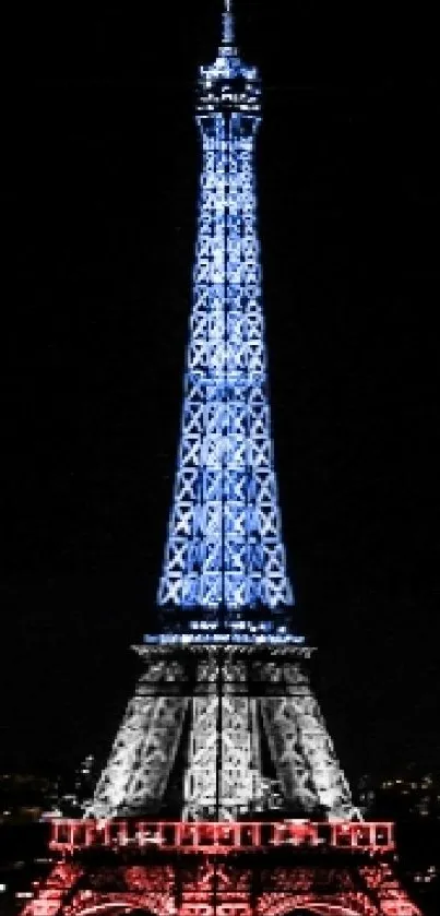 Eiffel Tower illuminated at night with vibrant lights in Paris cityscape.