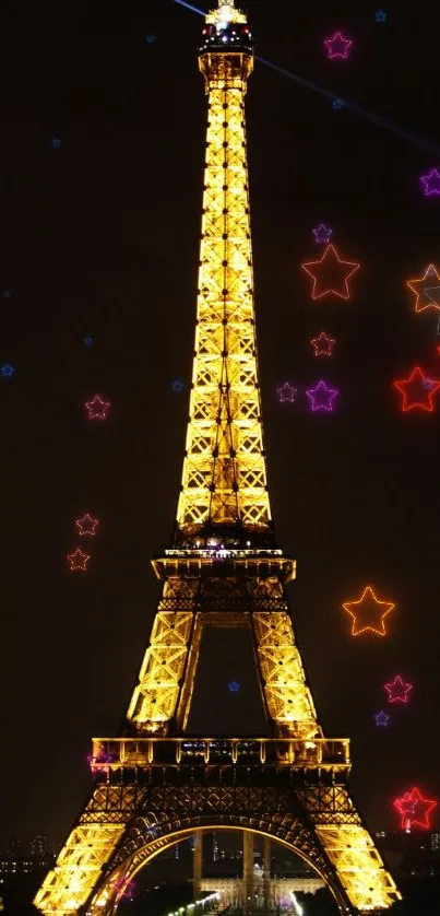 Eiffel Tower illuminated at night with colorful stars in the sky.