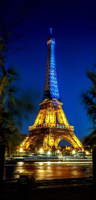 Illuminated Eiffel Tower against a blue night sky in Paris.