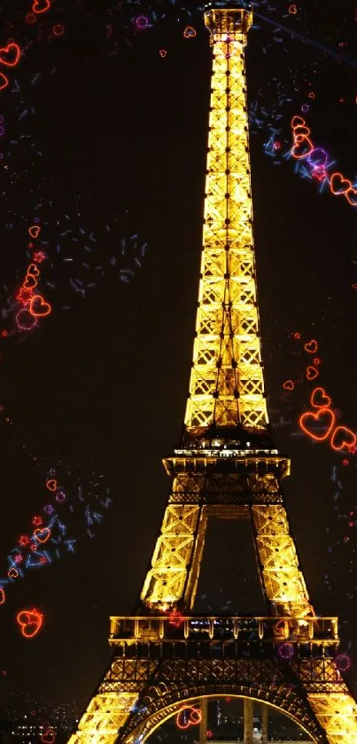 Night view of glowing Eiffel Tower with colorful heart lights.