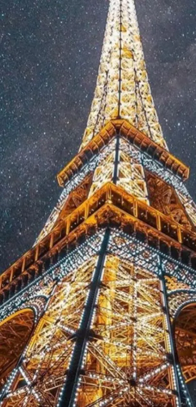 Eiffel Tower illuminated against a starry night sky.