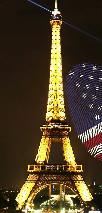 Eiffel Tower at night with American flag design glowing.