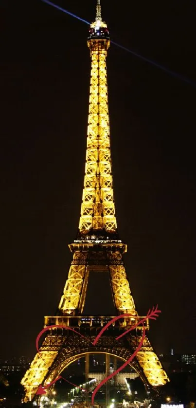 Eiffel Tower illuminated against the night sky, iconic Paris landmark.