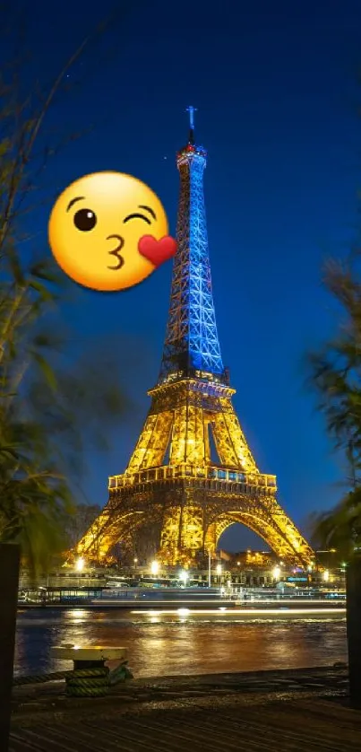 Eiffel Tower night view with a kiss emoji and vibrant lights.