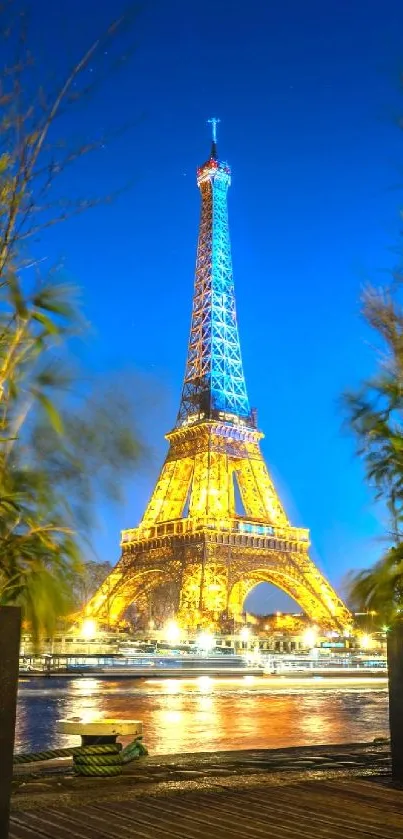 Eiffel Tower illuminated at night in Paris with scenic view.