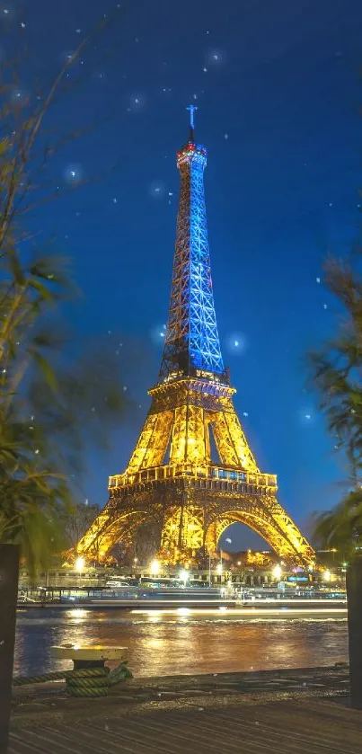 Eiffel Tower lit up at night with a dark blue sky and vibrant reflections.