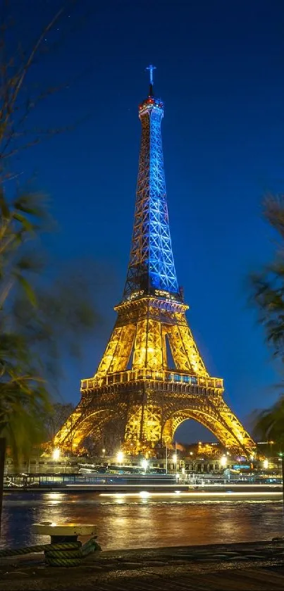 Eiffel Tower illuminated at night with vibrant cityscape backdrop.