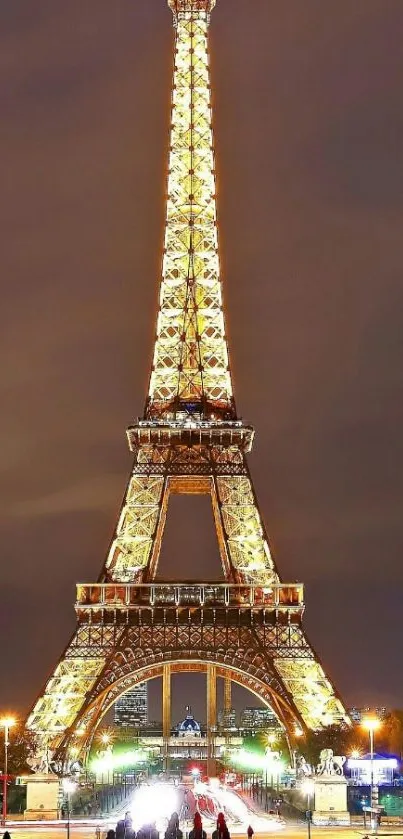 Eiffel Tower illuminated against a night sky, perfect for mobile wallpaper.