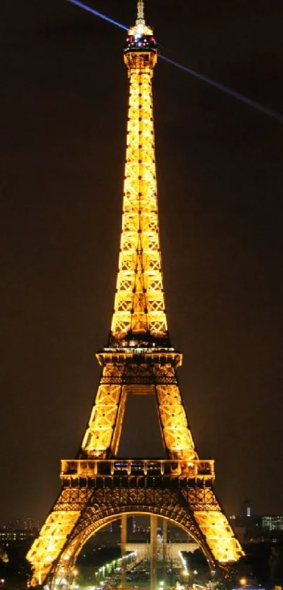 Eiffel Tower illuminated against night sky, perfect for mobile wallpaper.