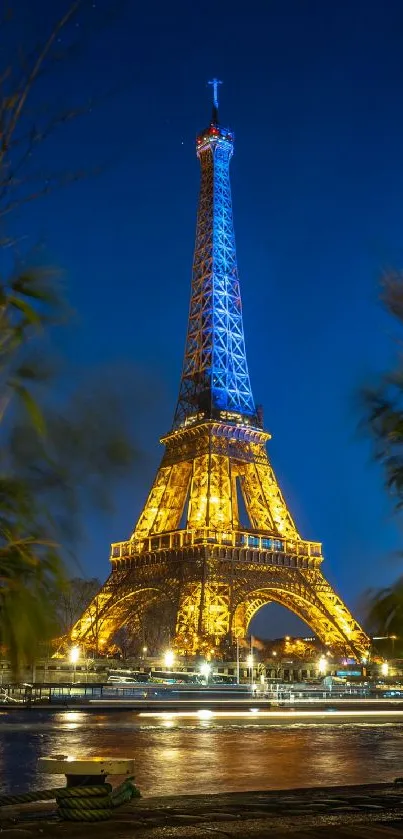 Eiffel Tower brightly lit against a deep blue night sky in Paris.