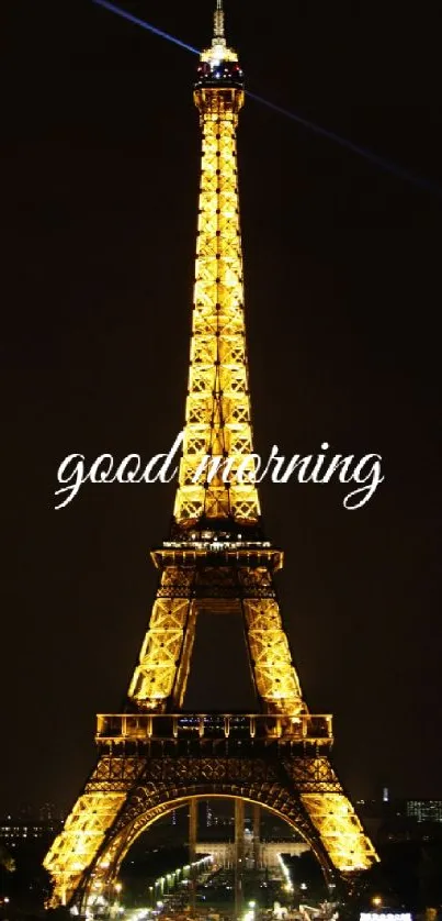 Eiffel Tower illuminated at night with 'Good Morning' text overlay.