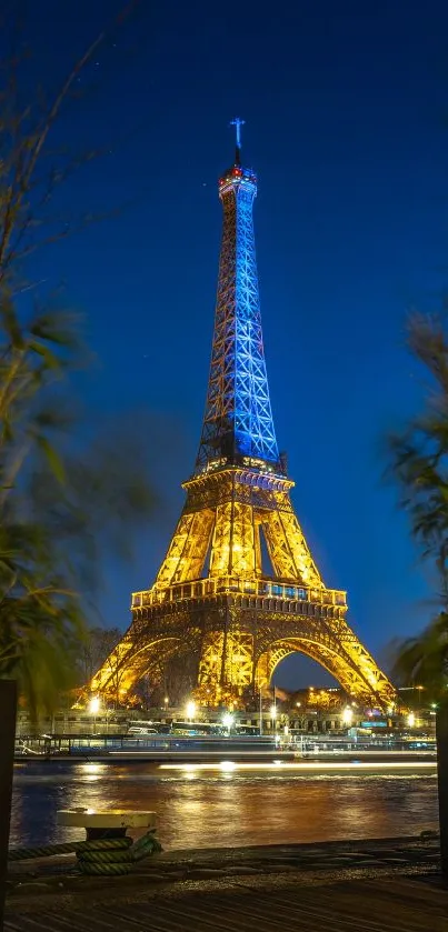 Eiffel Tower illuminated against a dark blue night sky in Paris.