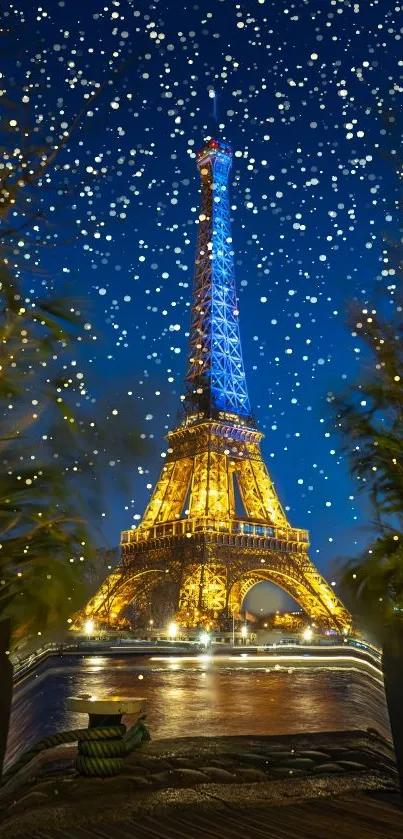 Eiffel Tower lit up at night with a blue sky backdrop and sparkling lights.