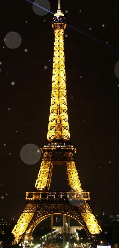 Illuminated Eiffel Tower at night in Paris.