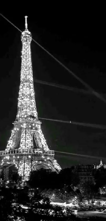 Black and white Eiffel Tower wallpaper, illuminated against a night sky.